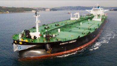 The tanker ship Kriti Hero sails on the ocean, representing Avin International's fleet.