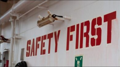 A massive container ship navigates open waters, symbolizing efficient and safe global maritime operations.