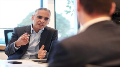 An OCI Global industrial plant for clean ammonia production, with a docked ship.