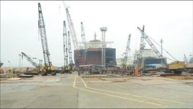 Workers dismantling a large vessel at the Bansal ship recycling yard in Alang, India.