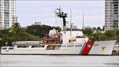 US Coast Guard boat conducting a search operation after a maritime strike.