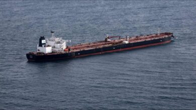 A large oil tanker, part of the shadow fleet, sails on the open sea.