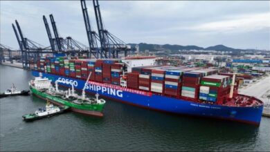 Cosco's methanol dual-fuel boxship, a large container vessel, sailing on open water.