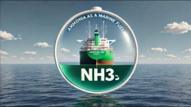 Large cargo ship with prominent green tanks on deck, likely an ammonia-fueled vessel.