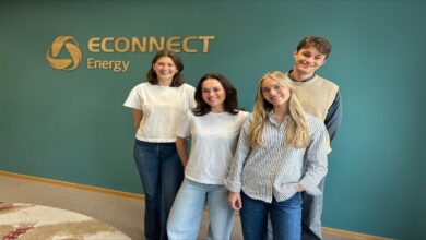A large cargo ship navigating open water, representing LNG marine fuel and sustainable shipping.