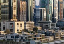 An aerial view of an extensive crude oil refinery with numerous industrial structures.