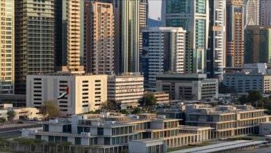 An aerial view of an extensive crude oil refinery with numerous industrial structures.