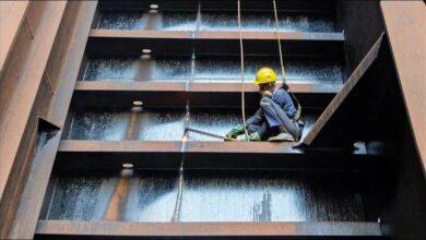 Ships from the shadow fleet are dismantled on a coastline at a scrap yard.