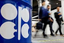 Oil pumpjacks operating in an oil field, representing crude output.