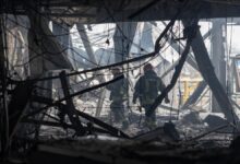 Smoke and flames erupt from oil storage tanks at a Russian Black Sea port after a drone attack.