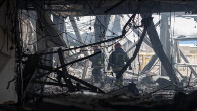 Smoke and flames erupt from oil storage tanks at a Russian Black Sea port after a drone attack.