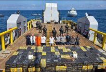 El Salvador Navy personnel alongside enormous bales of the record 6.6-tonne cocaine bust.