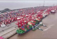 Shanghai port with modern ships, representing China's green fuel bunkering hub initiative.