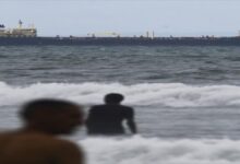 A massive oil tanker navigates calm waters, symbolizing global fuel oil trade.