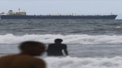 A massive oil tanker navigates calm waters, symbolizing global fuel oil trade.