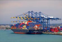 Large container ship navigating the ocean, symbolizing international shipping and global trade.