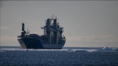 Cargo ship Ocean Giant navigates icy Antarctic waters during resupply mission.