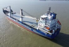 Heavy lift vessel at sea, illustrating advanced maritime connectivity.