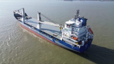 Heavy lift vessel at sea, illustrating advanced maritime connectivity.