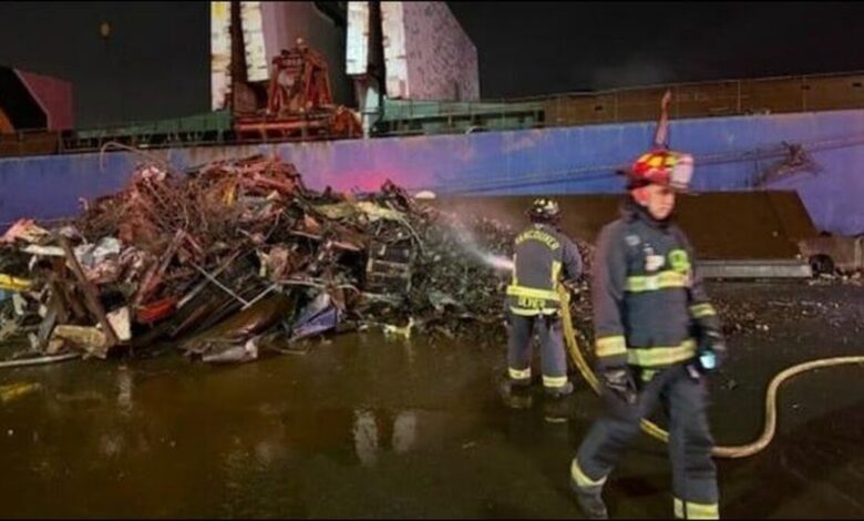 Firefighters extinguish a scrap metal fire on a bulker at the Port of Vancouver.