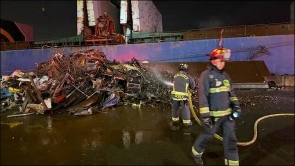 Firefighters extinguish a scrap metal fire on a bulker at the Port of Vancouver.