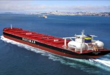 A CMB.TECH bulk carrier, powered by ammonia, sails across the ocean.