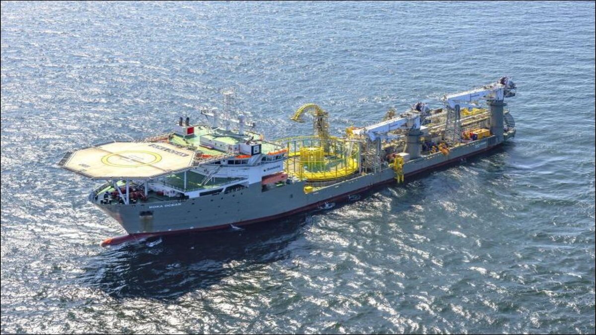 An offshore cable-laying vessel with large spools of inter-array cables at sea.