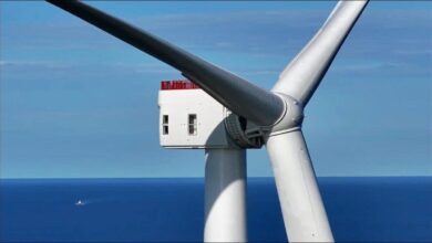 Multiple long white wind turbine blades for the Vineyard Wind offshore project.