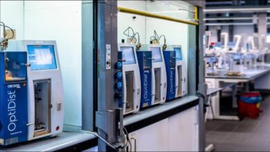 A large cargo ship sails on the ocean, symbolizing marine transport and alternative fuels.