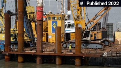 LNG tanker ship docked at an industrial port, vital for Germany's gas supply.
