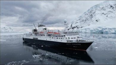 The expedition cruise ship Ocean Endeavour, chartered by Danish Defence, sails on blue waters.