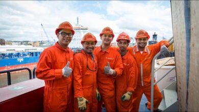 Executives from Harren Group and NSB Group shake hands, signifying their new crewing joint venture.