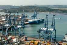 Container ships navigate the busy Panama Canal, central to global maritime trade deals.