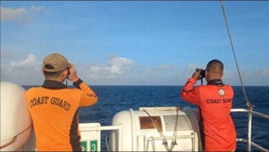 Philippine Coast Guard vessel searches during a maritime distress signal response.