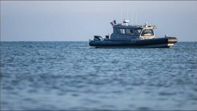 Dozens of migrants packed onto a small boat at sea during a Mediterranean rescue.