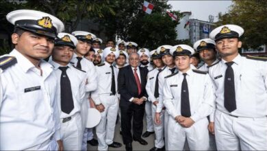 Angad Banga, CEO of Caravel Group, stands in a professional setting with subtle maritime elements.