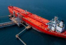 Large cargo ship navigating at sea, symbolizing increased marine fuel demand.