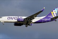 Avelo Airlines Boeing 737 aircraft with winglets, parked on an airport tarmac.