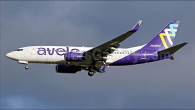 Avelo Airlines Boeing 737 aircraft with winglets, parked on an airport tarmac.