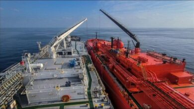 A large, modern vessel sailing, representing ammonia bunkering operations.
