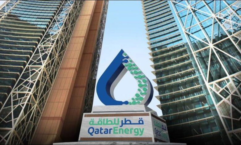 QatarEnergy's industrial natural gas liquefaction plant with storage tanks.