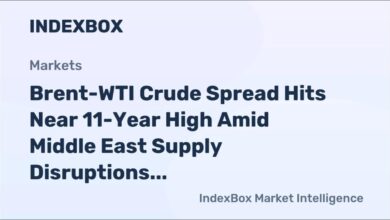 A massive crude oil tanker sails across the open sea.