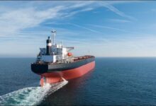 Large cargo ship sailing on the ocean, relevant to Genco and Diana Shipping.