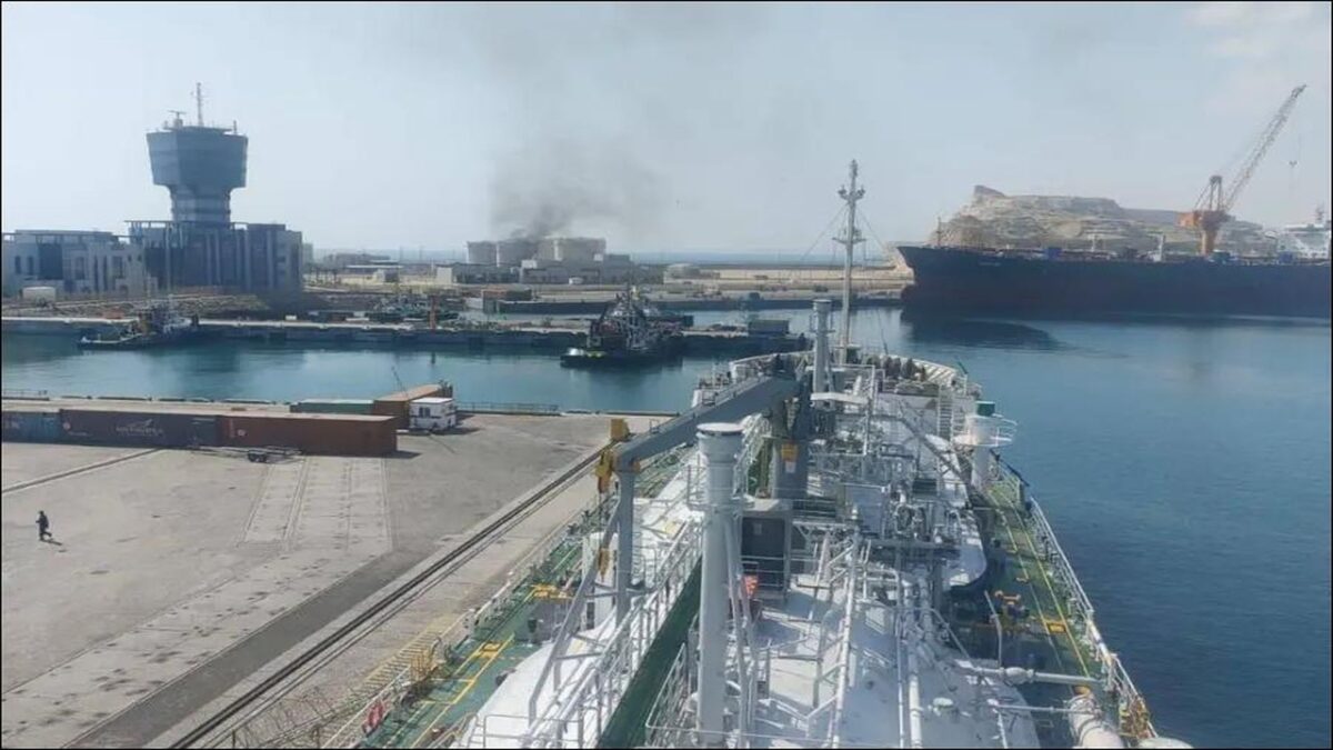 Salalah Port in Oman with cargo ships and shipping containers.