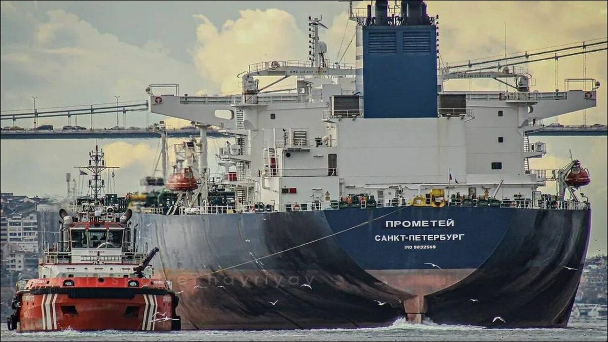 A large suezmax oil tanker sailing on calm open waters.