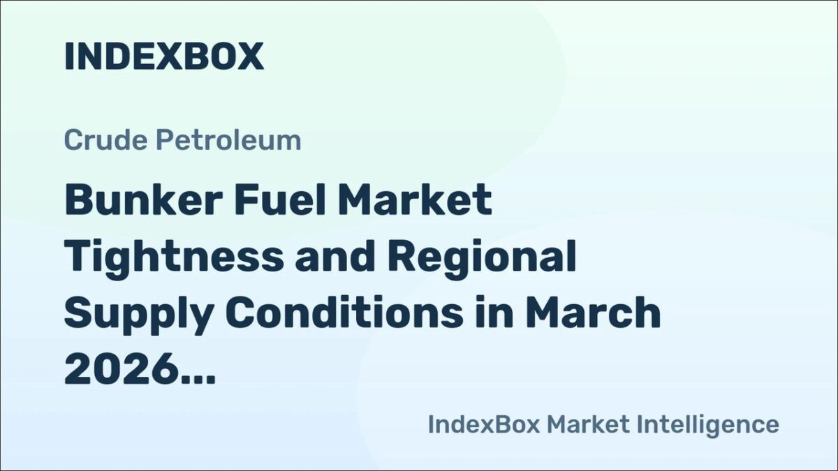 Bunker vessel refueling a large cargo ship in a busy Asian port.