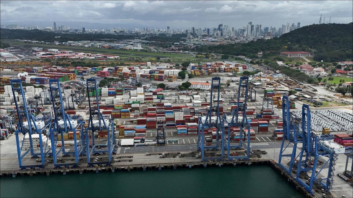 Container ships docked at a port facility along the Panama Canal.
