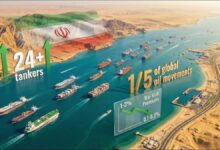 A large oil tanker navigates a strategic strait, symbolizing global energy shipping and market impact.