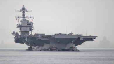 The USS Gerald R. Ford, the world's largest aircraft carrier, sails powerfully at sea.