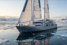 Oceanwide Expeditions' new hybrid eco-sail expedition ship navigating icy polar waters.